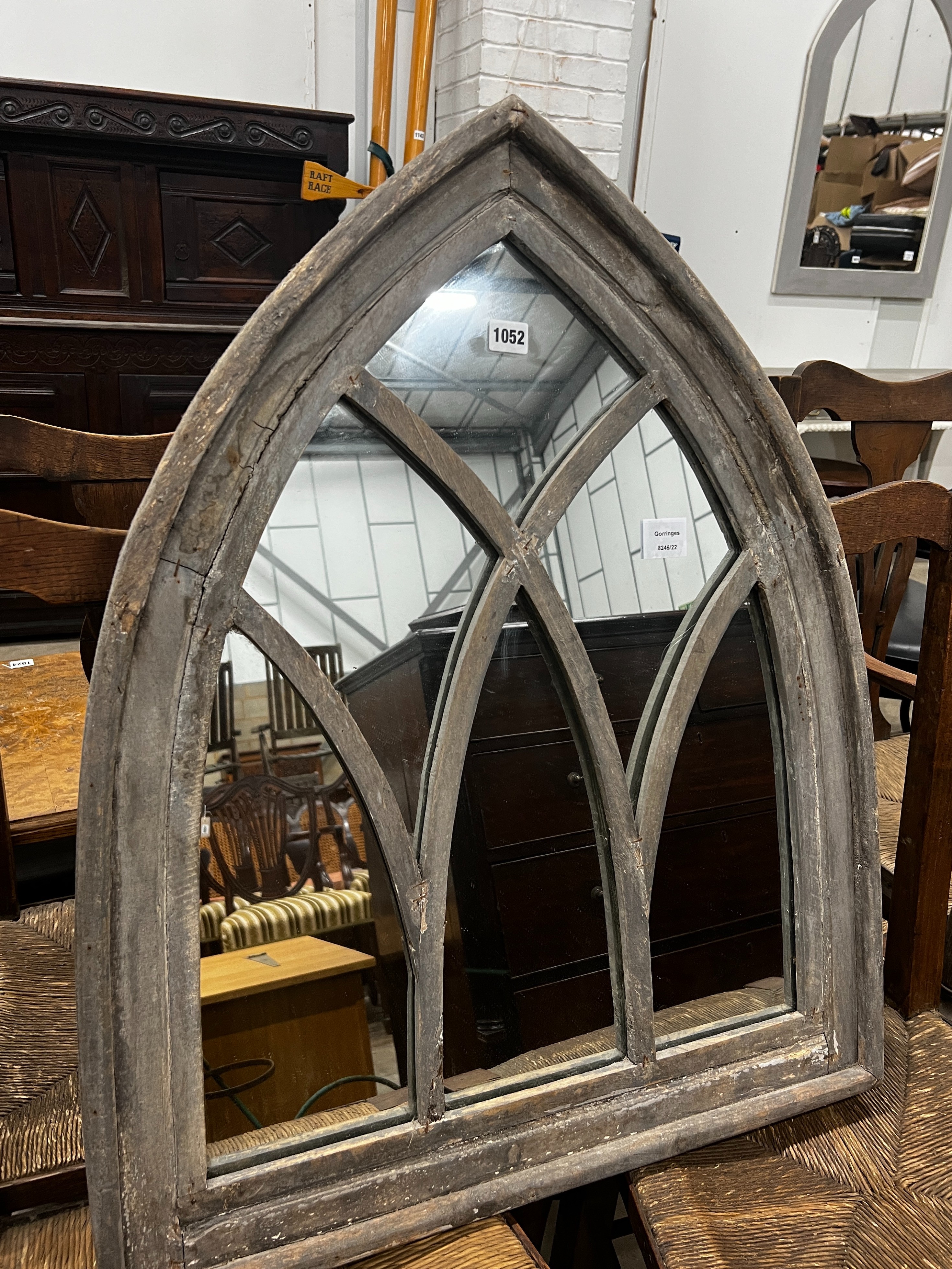 A gothic style painted arched wall mirror, width 66cm, height 81cm